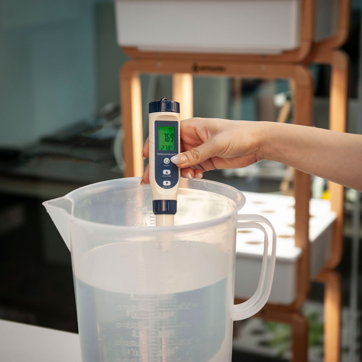 testing the PH level of water with the 5-1 multi water quality tester.