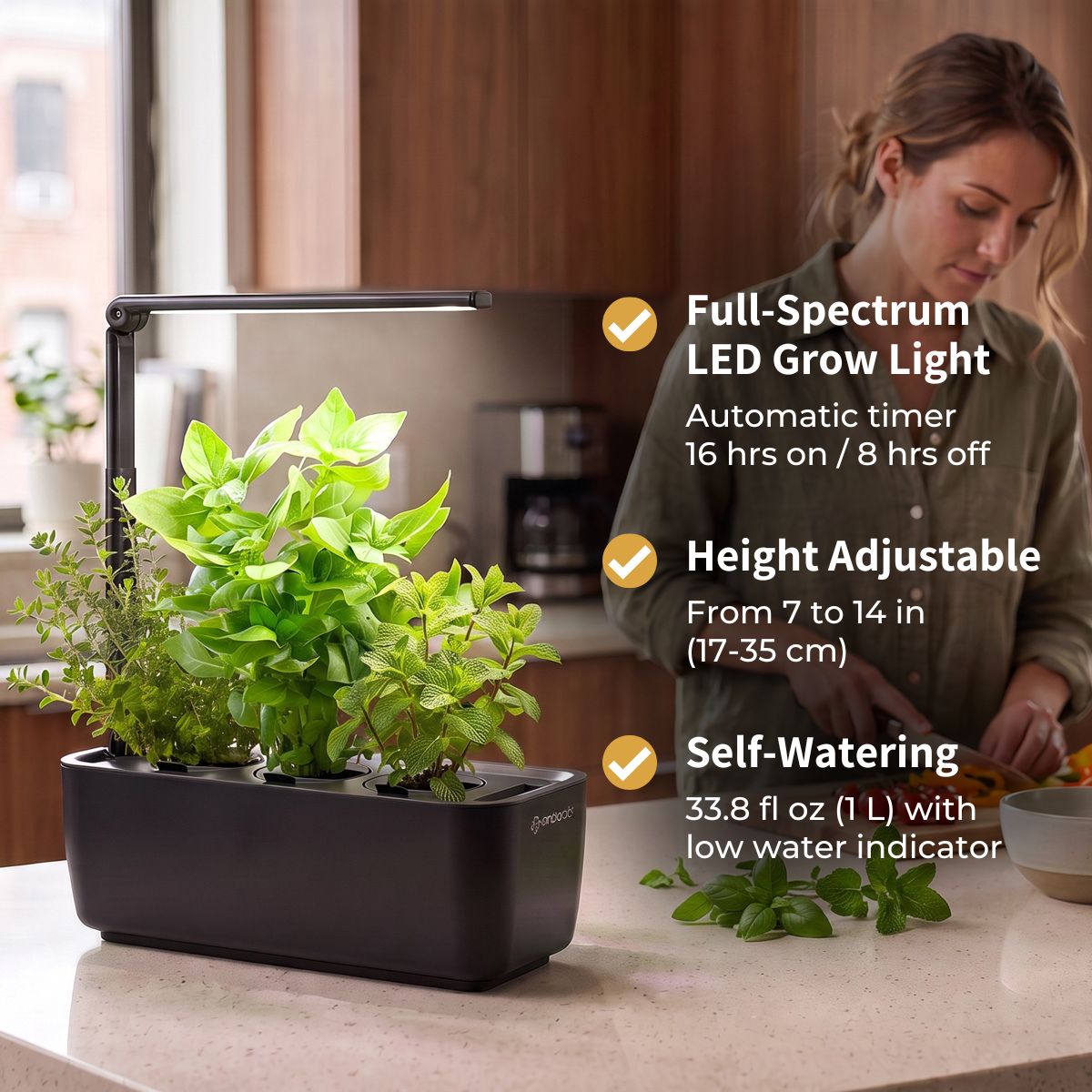 Ermonix LumiGarden 3, adjustable arm, and full-spectrum LED grow light, shown with several green herbs growing in it. A woman is visible in a kitchen in the background, and feature callouts on the right describe the 8W LED grow light, height adjustability, and self-watering system.