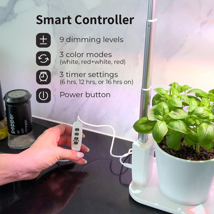 Smart controller for a grow light system with a plant on a table.
